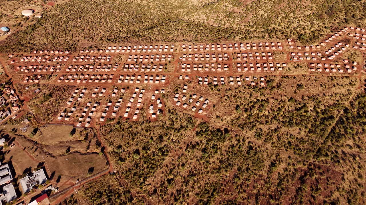 Neat patterns of government subsidized BNG housing project in rural area, aerial