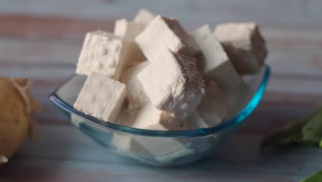 cubed tofu in a glass bowl