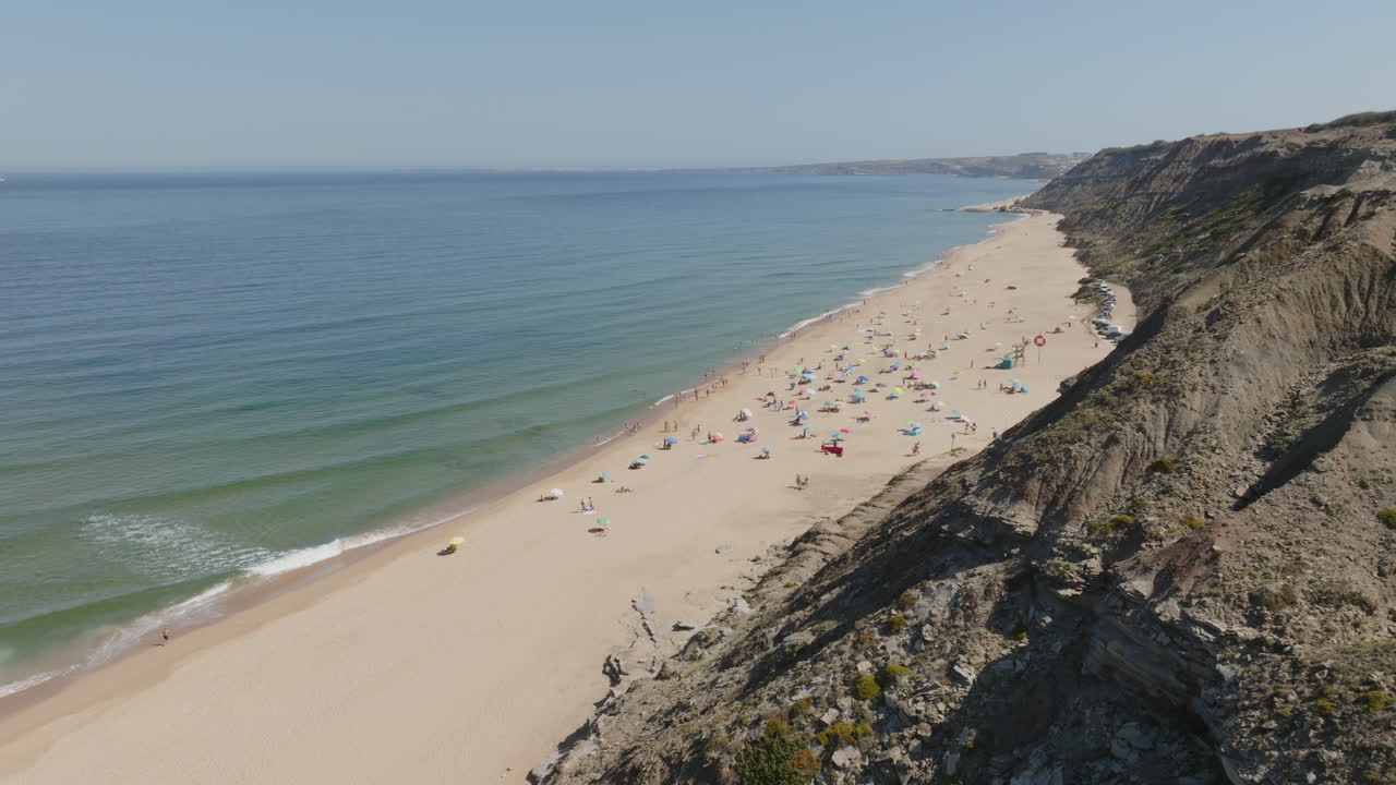 Crowded Beach Scene with People Relaxing on the Shore