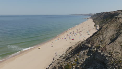crowded beach scene with people relaxing on the shore