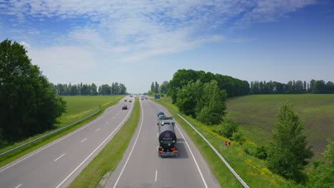 flight over the automobile driving. blue modern car driving throw the road.