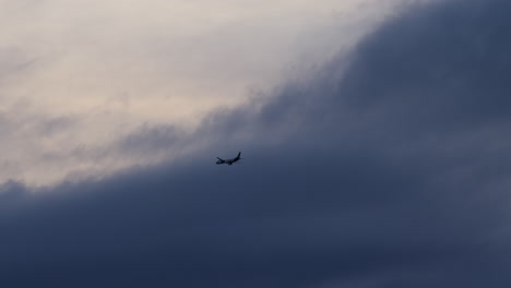 airplane flying through dark clouds