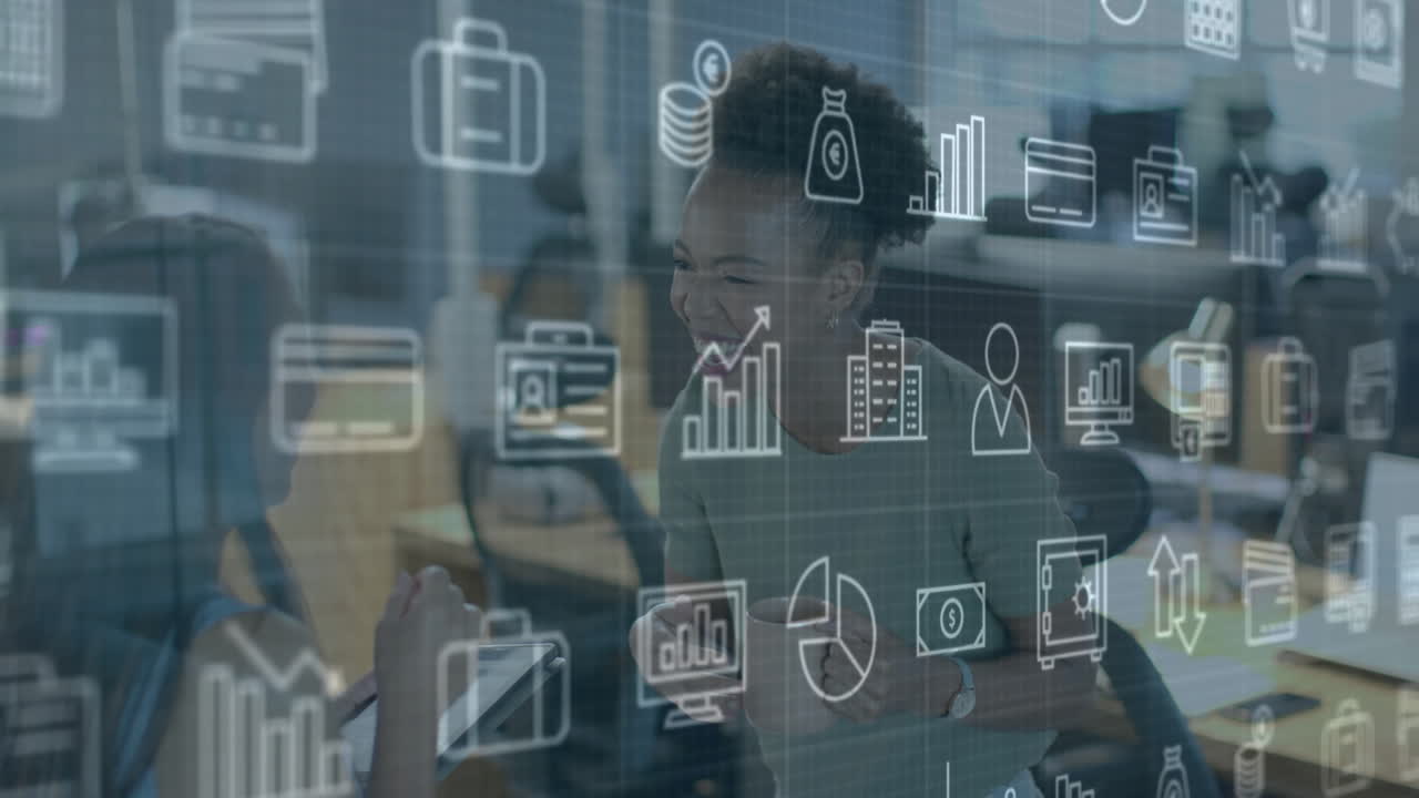 Animation of business icons over diverse female colleagues talking at casual office