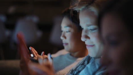 friends using technology at home at night hanging out shopping online