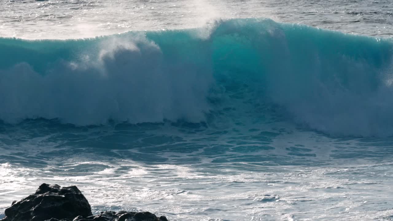Powerful Atlantic waves crash against the rugged volcanic coastline near Timanfaya National Park in Lanzarote, part of Spain’s Canary Islands.