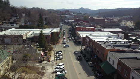 aerial pull out over the town of boone north carolina as fire truck enters the shot