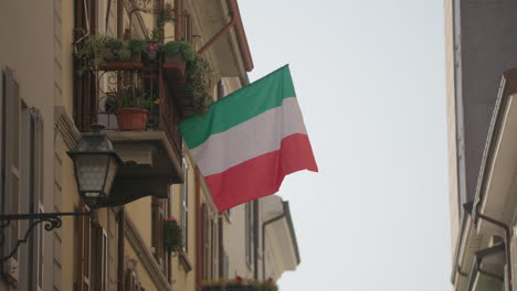 italian flag in a small town alleyway