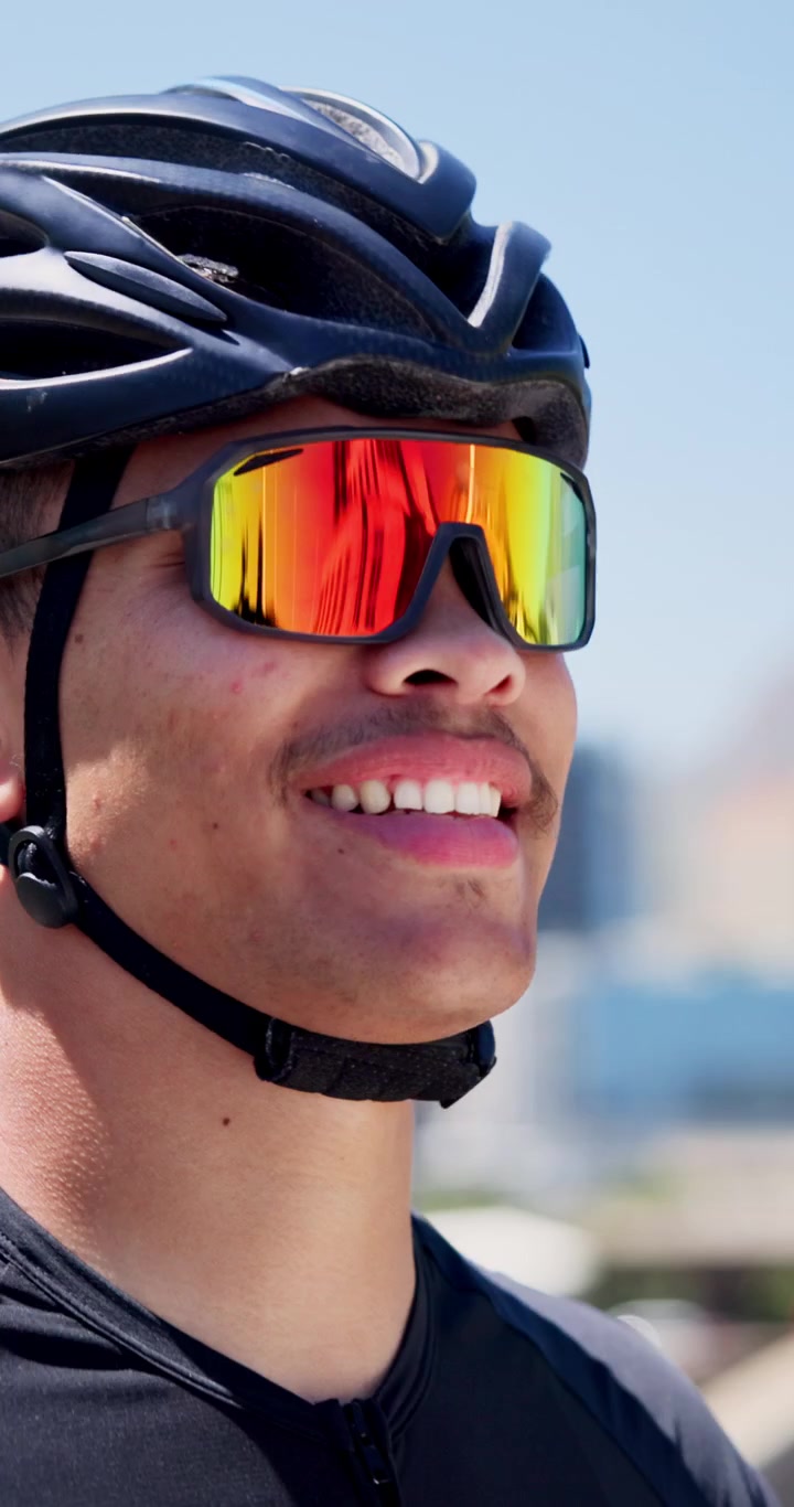 Young Cyclist Adjusting Helmet and Sunglasses Before a Ride