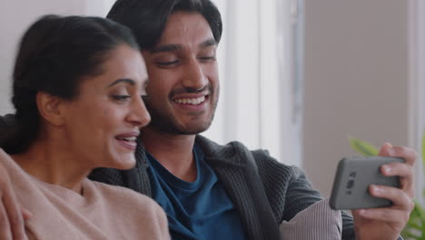 happy couple having video chat using smartphone chatting to friend smiling excited enjoying online communication on mobile phone