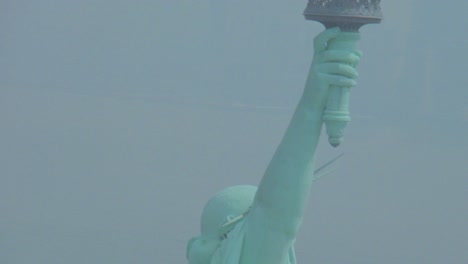 helicopter aerial of the statue of liberty in new york city