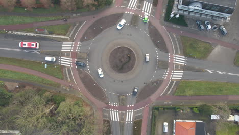 top down aerial of cars entering and leaving extremely busy roundabout