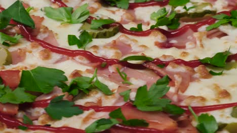 delicious ham and pickle pizza with ketchup and parsley