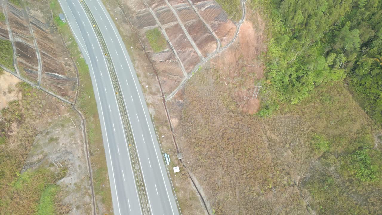Beautiful Drone View Of Bau To Lundu Pan Borneo Highway During Morning Sunset With Mountain And Valley, Green Forest,Sarawak, Borneo.