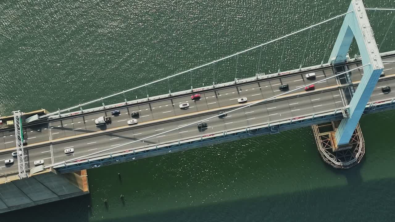 Drone view of traffic on bridge over water in New York City