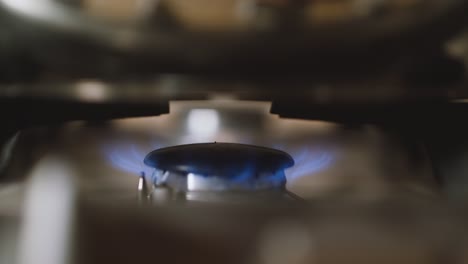 Turning-on-the-stove-extreme-close-up-shot-with-shallow-depth-of-field