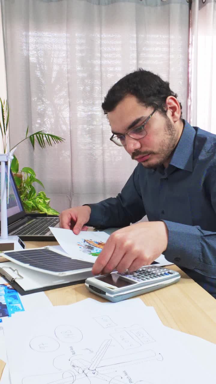 Designer Reviewing a Colorful Illustration for an Eco Campaign