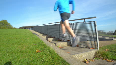 Runner man running outdoors in park
