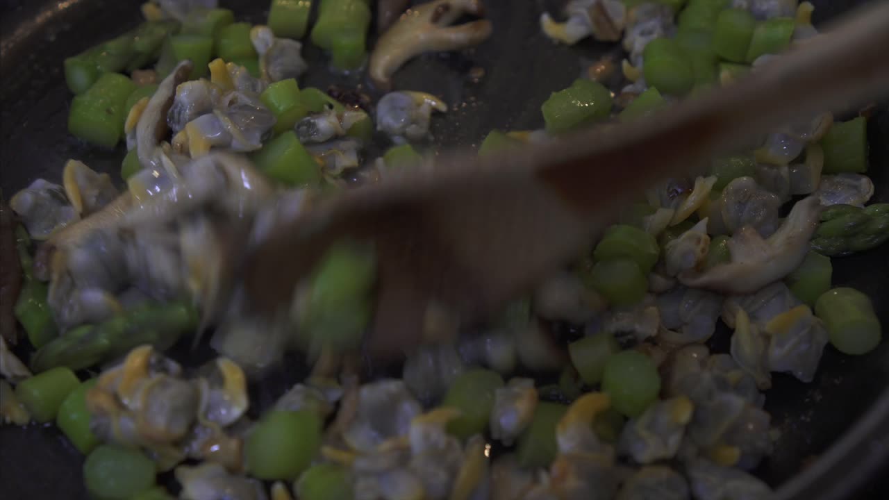 Close Up of Chef Stirring Clams and Asparagus