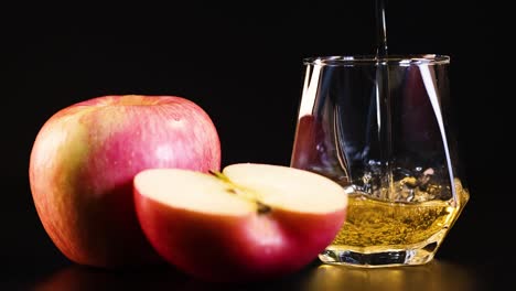 apple juice poured beside fresh apples