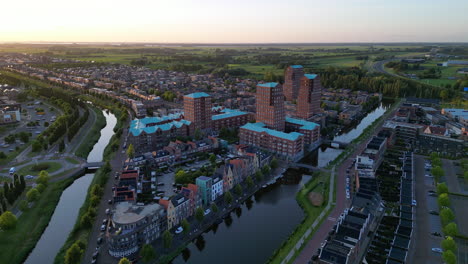 golden hour with modern buildings at amersfoort vathorst, the netherlands