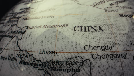 close-up of a world globe, focusing on china
