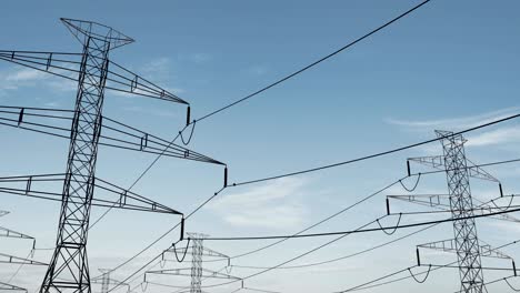 high voltage electricity tower and power lines under the beautiful sky. loop