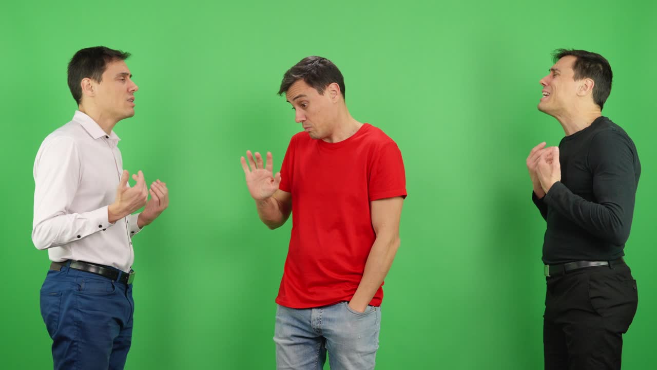 Man arguing with himself on green screen