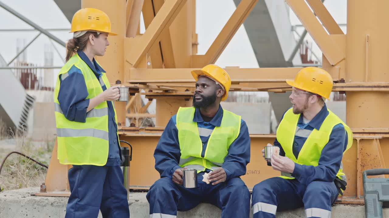 Cheerful Construction Workers Eating Lunch