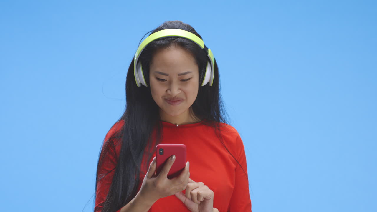 Woman listening to music on her phone