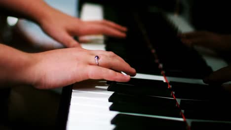 woman playing a piano