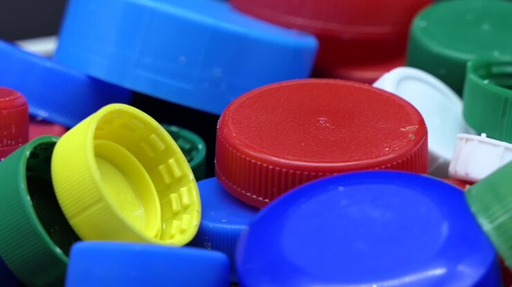 Closeup of Coloured Plastic Recycling Plugs that rotate slowly