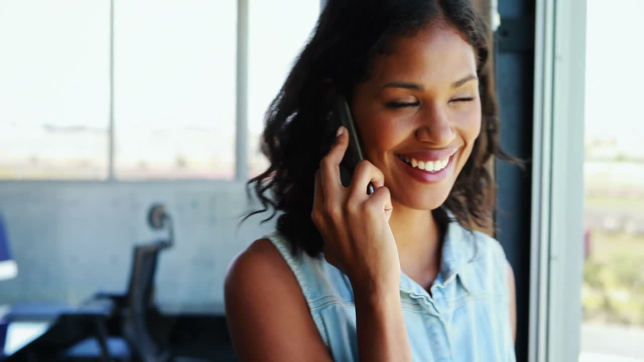 Happy executive talking on mobile phone 4k