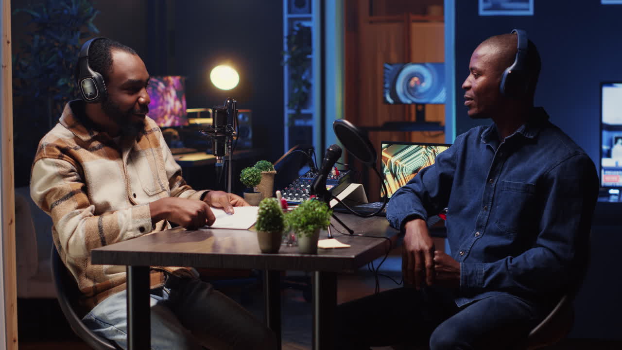 Podcast journalist fist bumping guest, ready to start listening to his interesting story