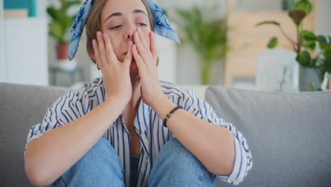 Sad-Woman-Sitting-Alone-On-Sofa