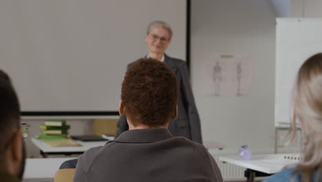 classroom scene with students and a teacher