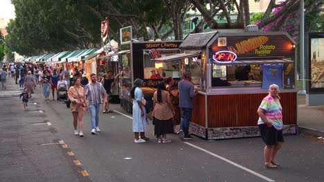 night market street food scene with crowds of people