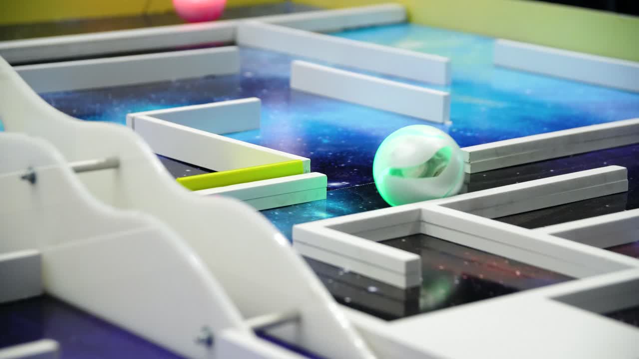 Robot navigating a glowing maze