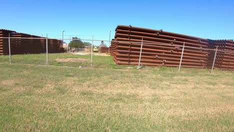 POV-distance-view-of-a-stockpile-of-panels-for-building-the-border-wall