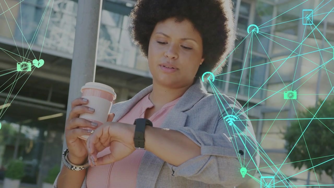 Midadult woman tapping smartwatch holding cup, checking tech alerts while cyan icons covering right
