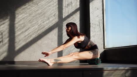 woman stretching with foam roller