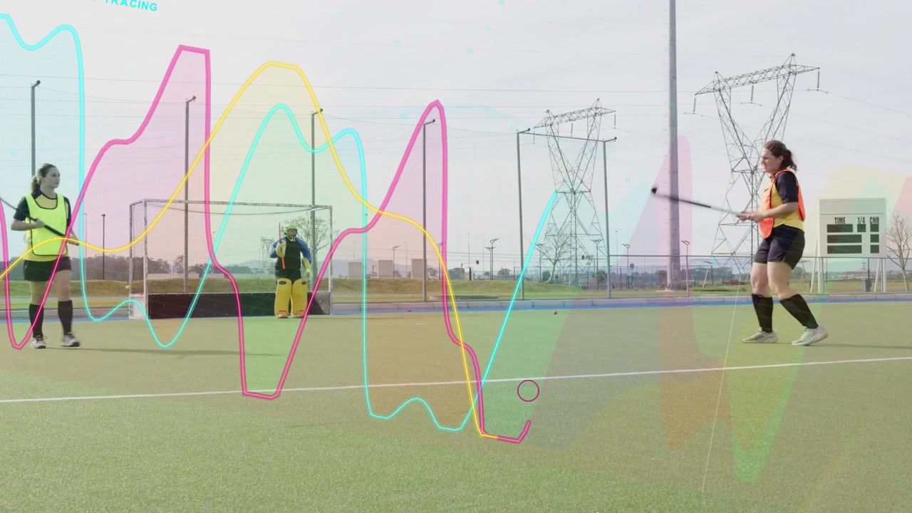 Woman hockey player coming and striking ball during training, keeper saving, graphs over players