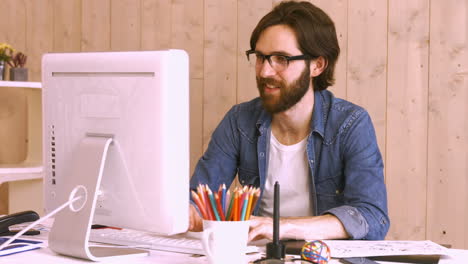 casual worker using computer at desk