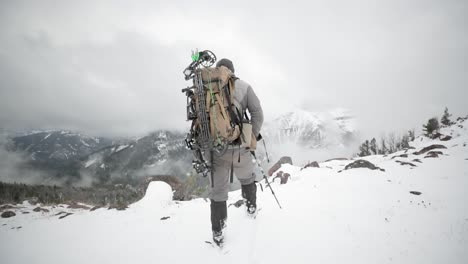 archery bow elk hunting in the snow in montana in october in the snow