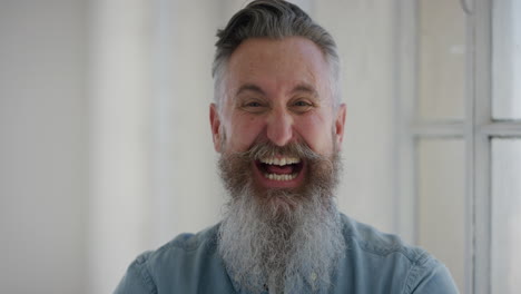 portrait-of-mature-caucasian-man-laughing-excited-looking-at-camera-enjoying-successful-lifestyle-senior-male-with-stylish-beard