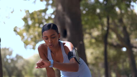 Running,-woman-and-check-smart-watch-outdoor