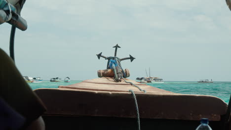 Boat-bow-sailing-through-Zanzibar's-clear-waters