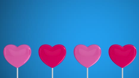 corazones rosados rojos en palos blancos en un fondo aislado azul. mover a la izquierda y girar. copiar espacio. símbolos de amor, como, feliz de las mujeres, la madre, el día de san valentín, cumpleaños.