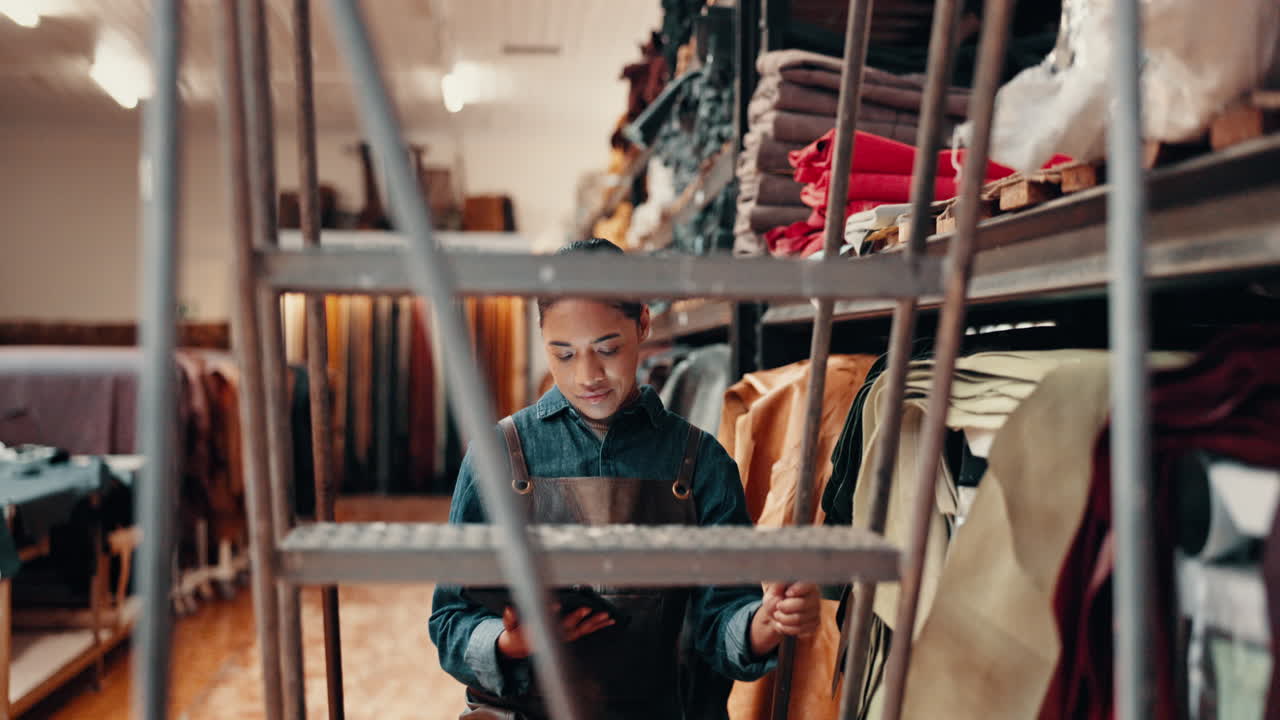 Tablet, leather workshop and woman at shelf
