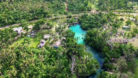 aerial drone landscape view of blue lagoon travel tourism swimming spot holiday destination jungle rainforest port vila eton village vanuatu pacific islands 4k