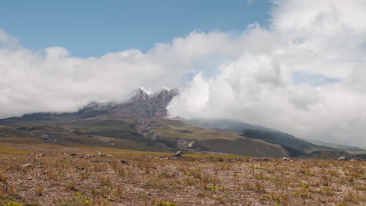 Timelapse of clouds billowing across cotopaxi volcano in ecuador, sunny day
